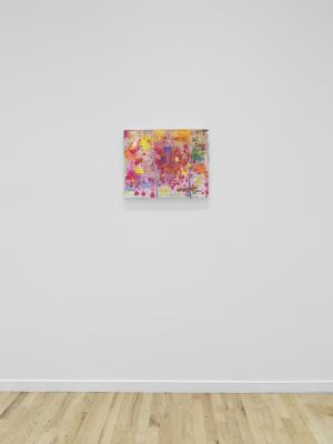 A small pink and red abstract painting hangs on a white wall.