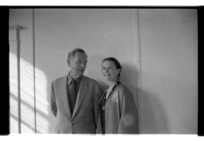 A black-and-white portrait of Joseph Campbell and Jean Erdman standing against the wall in EDAM studio. 