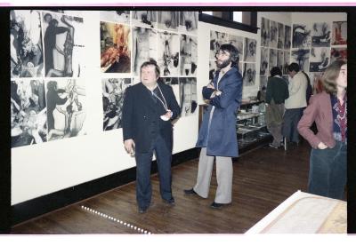 Herman Nitsch and Robert Keziere stand in front of a photographic installation in Western Front’s gallery. 