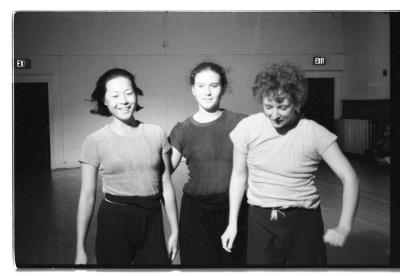 A black-and-white photo of Denise Fujiwara, Paula Ravitz and Susan McKenzie. They all wear t-shirts and sweatpants.